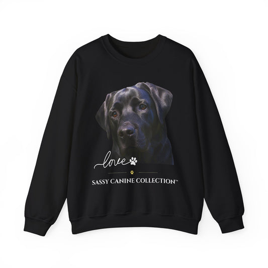 A black crewneck sweatshirt featuring a graphic print of a black Labrador Retriever's face, with the text 'Love' in script, a paw print, and 'SASSY CANINE COLLECTION' printed below.