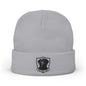 A light gray knit beanie hat with a folded cuff, featuring a black and white graphic of a dog inside a shield with the text 'BLACK LAB' below it.
