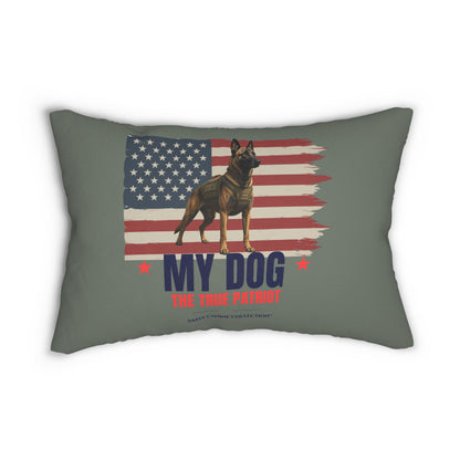 A throw pillow in a muted sage green color, featuring a German Shepherd dog standing in front of a distressed American flag. The text 'MY DOG THE TRUE PATRIOT' is printed below the dog in navy blue and red.