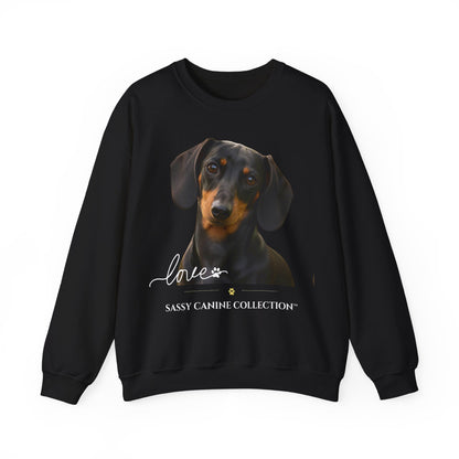 A black crewneck sweatshirt featuring a graphic print of a dachshund dog with the text 'love' and 'SASSY CANINE COLLECTION' on the front, displayed against a plain white background.