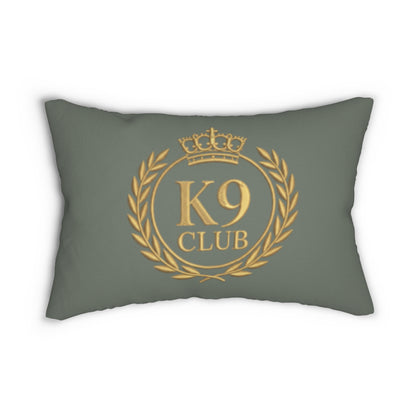 A rectangular throw pillow in a muted sage green color, featuring a gold printed K9 Club emblem on the front with a crown, laurel wreath