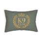 A rectangular throw pillow in a muted sage green color, featuring a gold printed K9 Club emblem on the front with a crown, laurel wreath