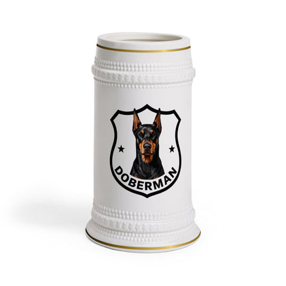 A white ceramic beer stein featuring a printed black and brown Doberman dog crest with the word 'DOBERMAN' on a clean white background.

