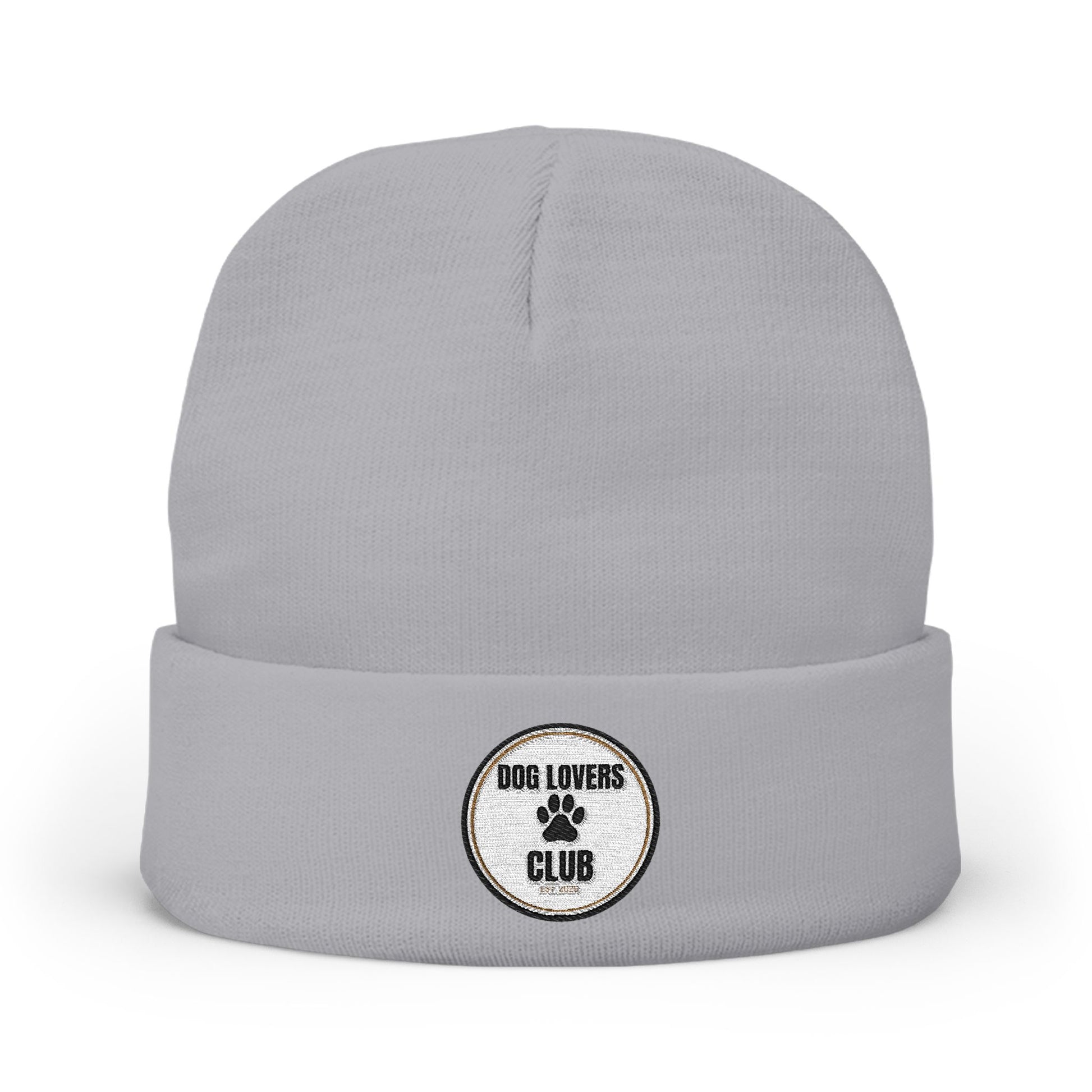 A light gray knit beanie hat with a folded cuff, featuring a circular embroidered patch on the front that reads 'DOG LOVERS CLUB' with a paw print.