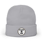 A light gray knit beanie hat with a folded cuff, featuring a circular embroidered patch on the front that reads 'DOG LOVERS CLUB' with a paw print.