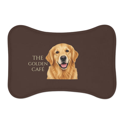 A dark brown bone-pet feeding mat featuring a Golden Retriever and the text 'THE GOLDEN CAFE' 