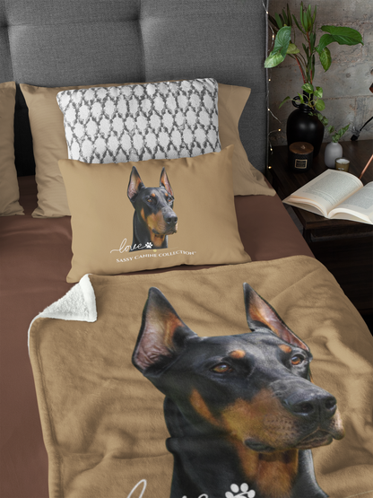 a tan bedding set with a large printed Doberman portrait on the blanket and matching pillow. Both items sold separately