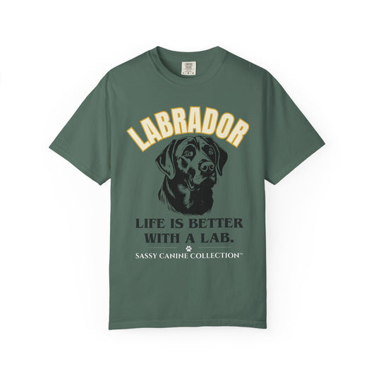 A dark green short-sleeve t-shirt with a graphic print of a Labrador dog and the text 'LABRADOR LIFE IS BETTER WITH A LAB. SASSY CANINE COLLECTION' on a white background.