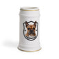 A white ceramic beer stein featuring a custom printed graphic of a French Bulldog inside a black shield with the word 'FRENCHIE' below it. The stein has gold trim at the rim and base, set against a plain white background.