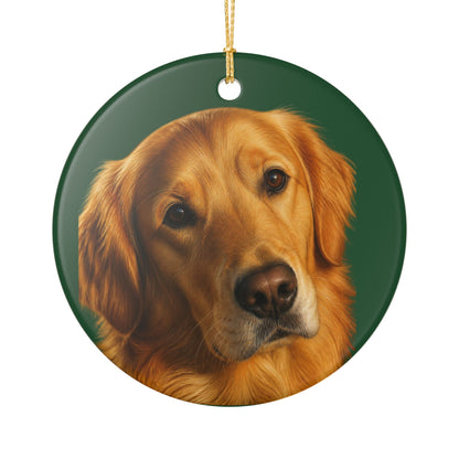 A round ceramic Christmas ornament featuring a painted portrait of a golden retriever on a dark green background