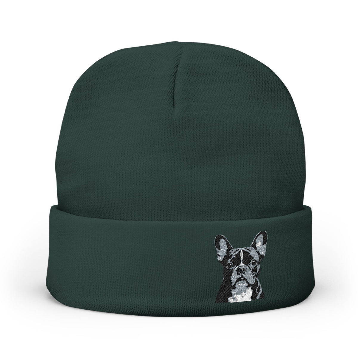 A dark forest green knit beanie hat featuring an image of a French Bulldog