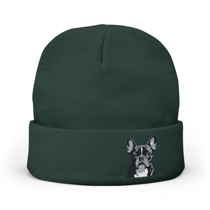 A dark forest green knit beanie hat featuring an image of a French Bulldog
