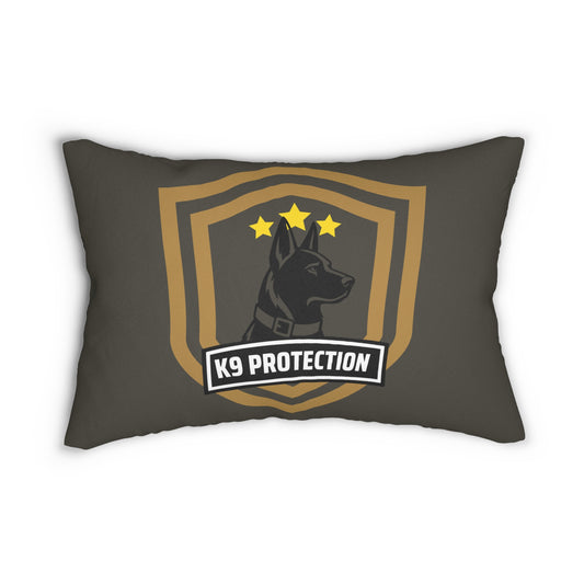 A dark gray throw pillow featuring a large a German Shepherd inside a gold shield with three stars and a banner reading 'K9 PROTECTION'.