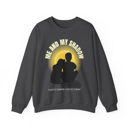 A dark gray crewneck sweatshirt featuring a graphic print of a silhouette of a couple sitting in front of a yellow sun, with the text 'ME AND MY SHADOW' arched above and 'SASSY CANINE COLLECTION' printed below