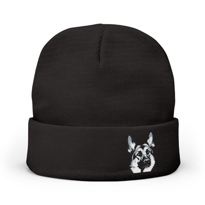 A black knit beanie hat with a folded cuff, featuring a German Shepherd 