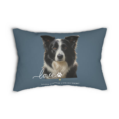 A  decorative lumbar pillow in slate blue with a printed portrait of a black and white dog and the text 'love' and 'Sassy Camille Collection' on the front.
