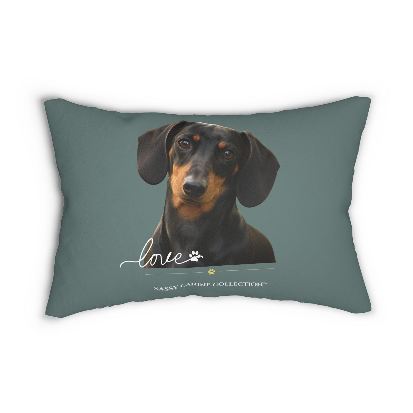 A rectangular decorative throw pillow in a muted slate blue-gray color, featuring a printed portrait of a black and tan dachshund with the word 'love' and 'Sassy Canine Collection' printed below.