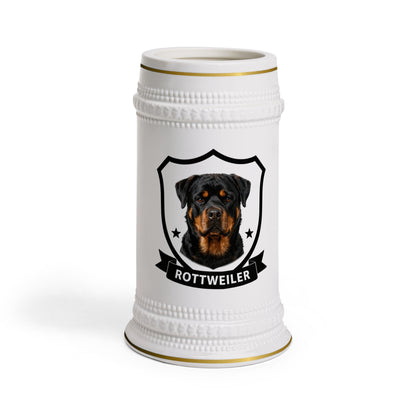 A white ceramic beer stein featuring a custom Rottweiler dog portrait inside a black shield emblem with the text 'ROTTWEILER' on a banner, set against a plain white background.