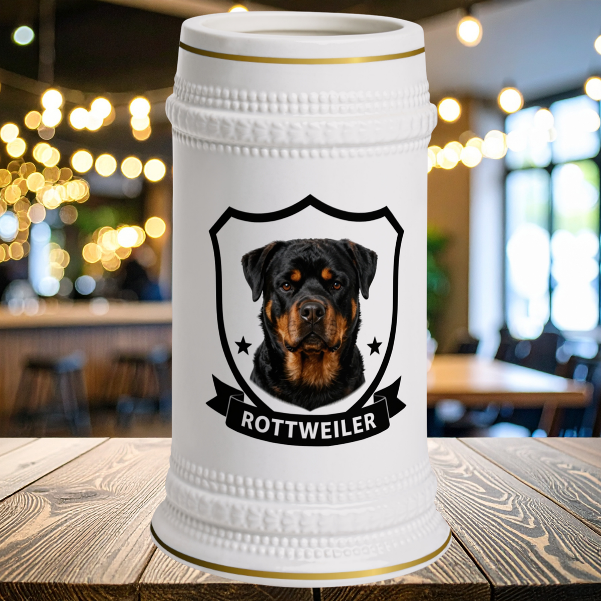 A white ceramic beer stein with gold trim and a custom Rottweiler dog 