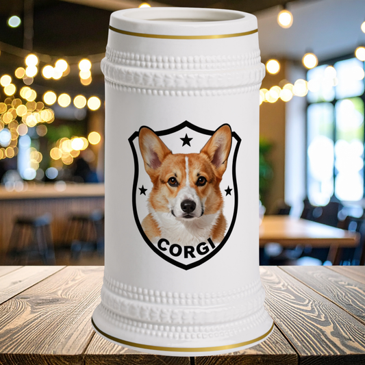 A white ceramic beer stein with gold trim and a printed Corgi shield emblem