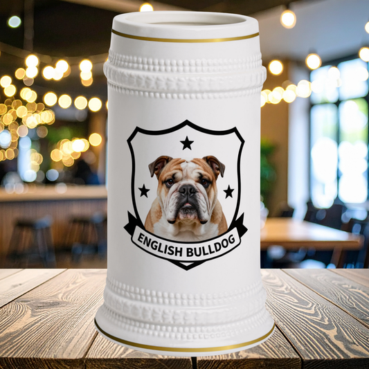 A white ceramic beer stein with gold trim and a black shield emblem featuring an English Bulldog portrait and the text 'ENGLISH BULLDOG