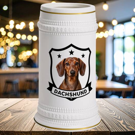 A white ceramic stein with gold trip with a portrait of a Dachshund on front